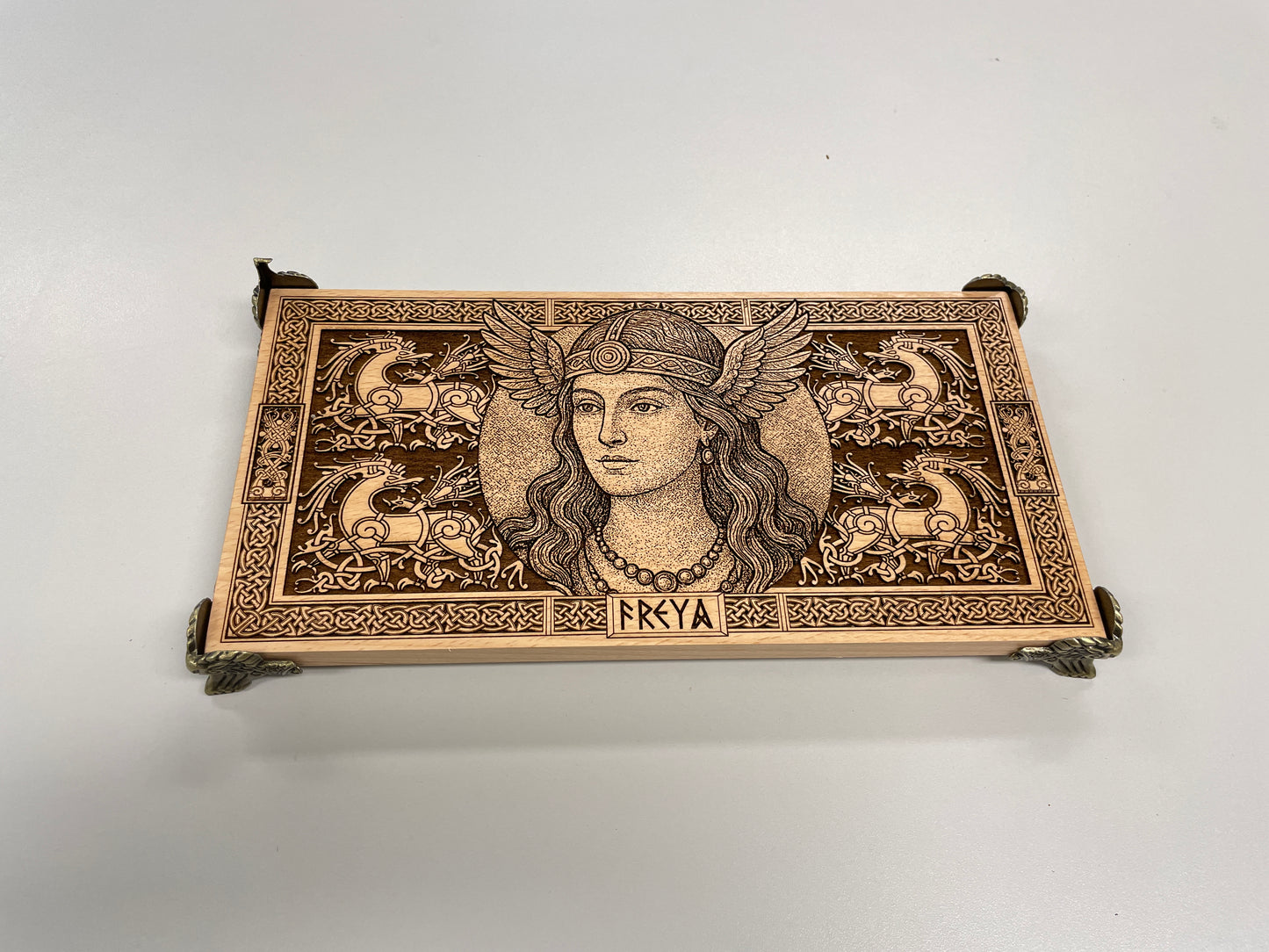 Decorative Viking altar with an engraved design of Freya on a white background