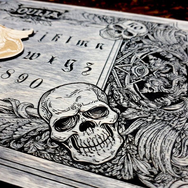 Ouija board with demons and skulls wooden engraving, wood gothic skull spirit board in vintage look. - Forgotten Engravings dark-ouija-board-spirit-board-with-demons-and-skulls-wooden-engravi