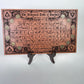 Occult alchemy decor board with zodiac coin symbols displayed on altar

