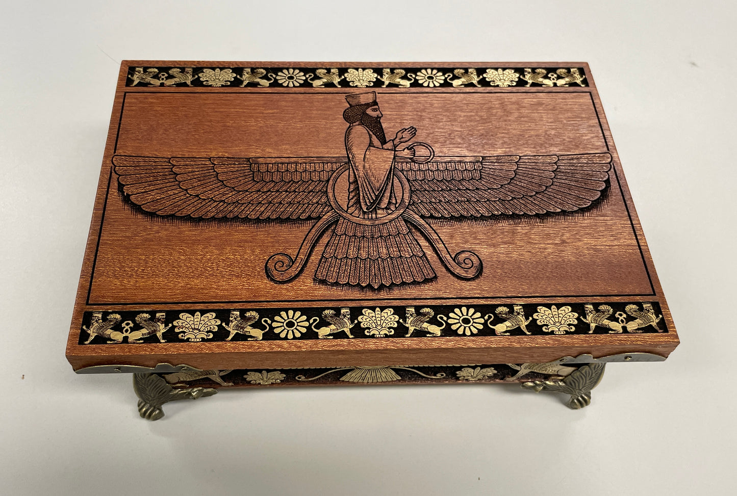Mahogany Zoroastrian altar box engraved with Faravahar and sacred fire symbols, ritual storage chest
