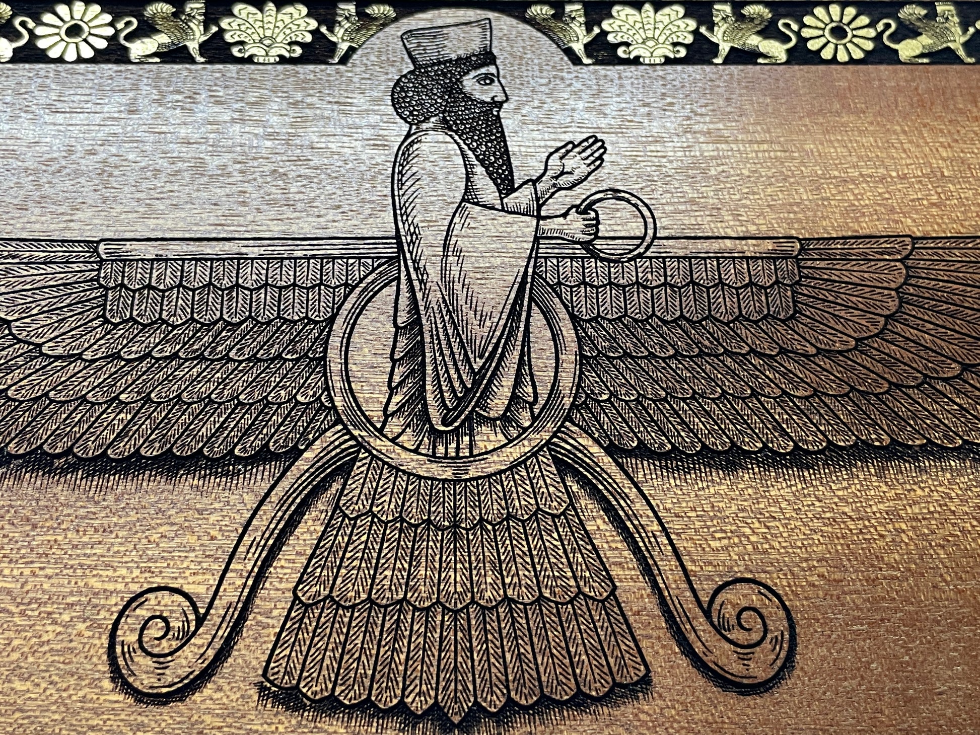 Close up of Faravahar Zoroastrian symbol deeply engraved in real mahogany wood, hand painted Persian spiritual wall art, not a print
