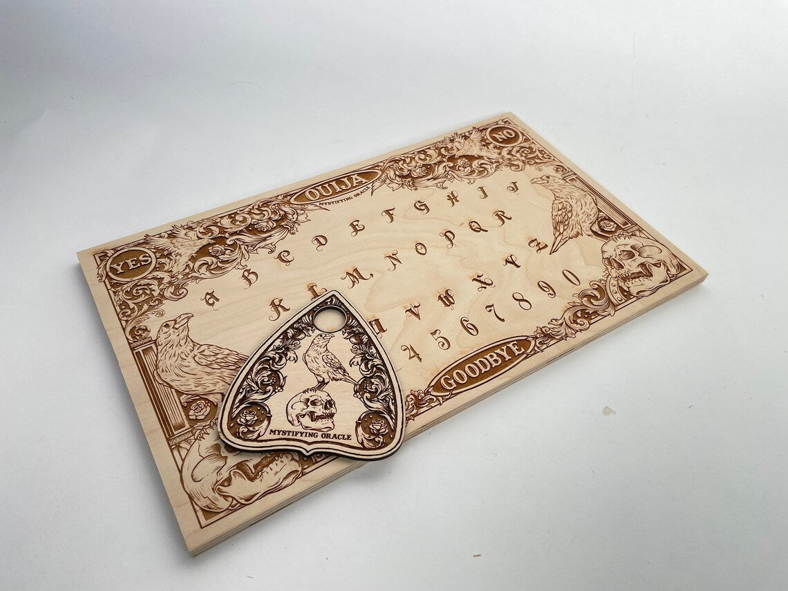 Edgar Allan Poe inspired gothic ravens  Ouija board for spirit communication 
