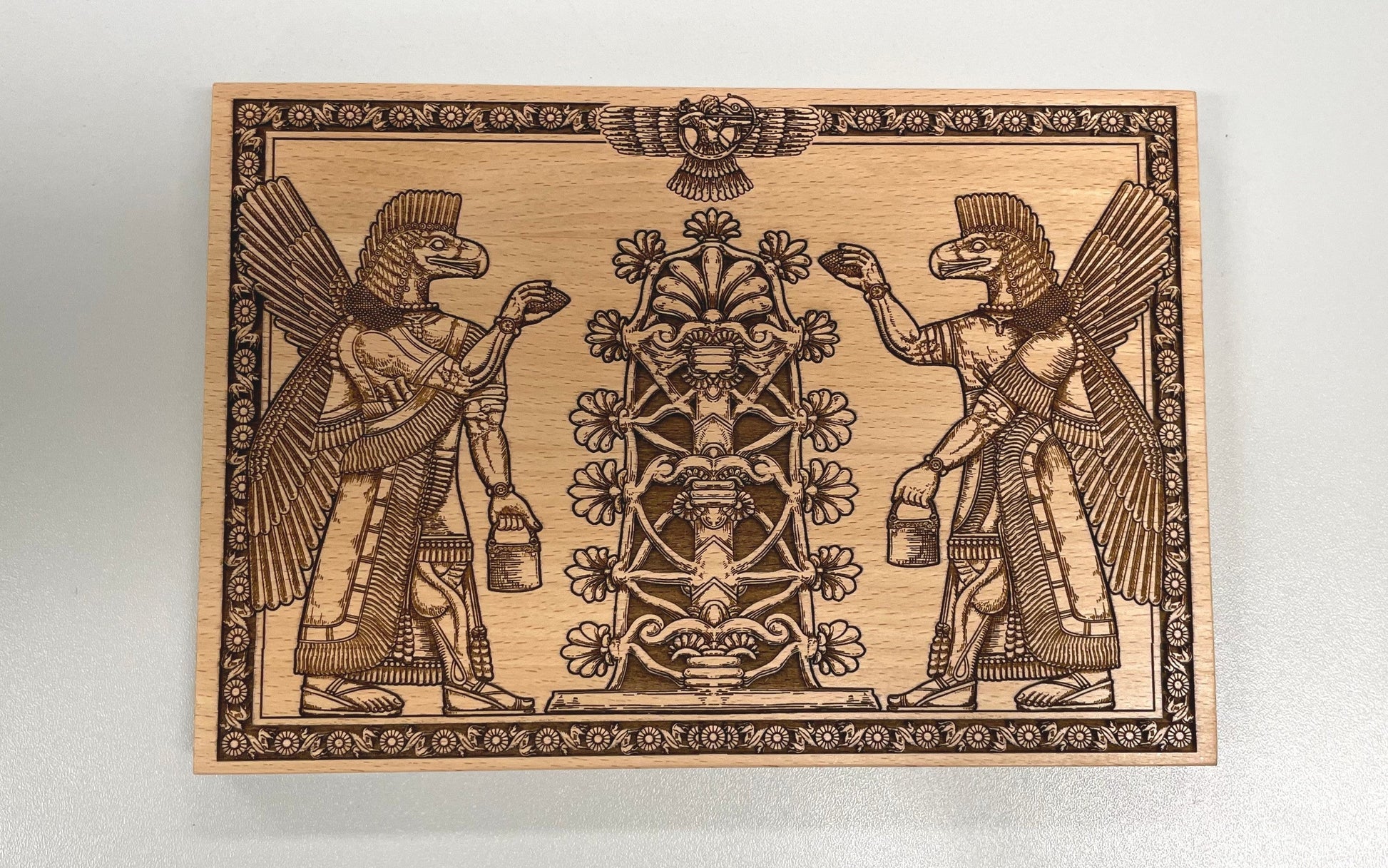 Anunnaki winged Sumerian god engraved wood art with Persian Tree of Life motif
