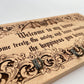 Wooden plaque with engraved Dracula quote and decorative elements on a white background