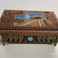 Close up of hand-painted Eye of Horus engraving on mahogany tarot and jewelry box
