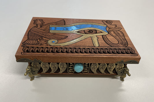 Close up of hand-painted Eye of Horus engraving on mahogany tarot and jewelry box
