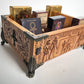 Detail of Egyptian Book of the Dead engraved artwork on wooden tarot deck organizer
