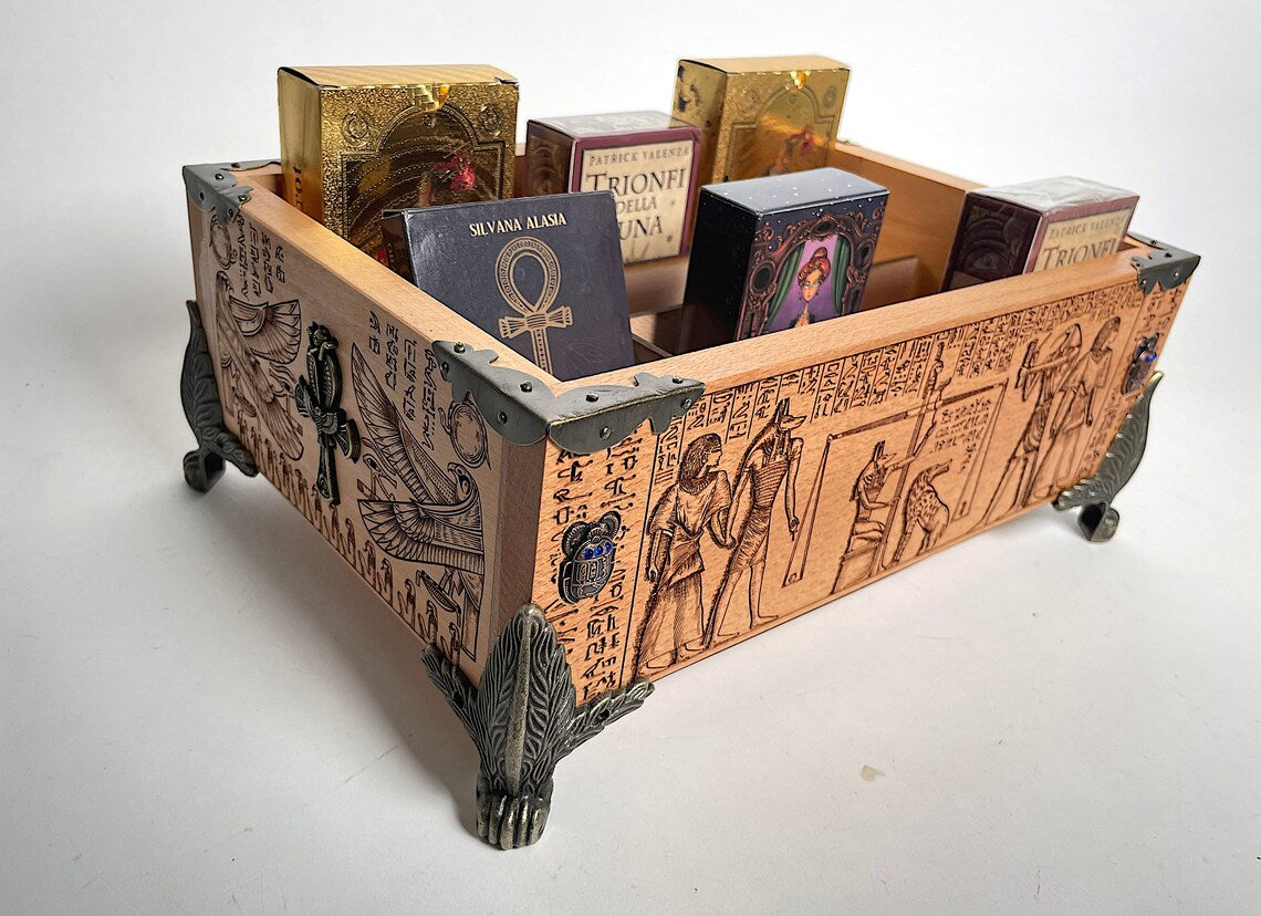 Detail of Egyptian Book of the Dead engraved artwork on wooden tarot deck organizer

