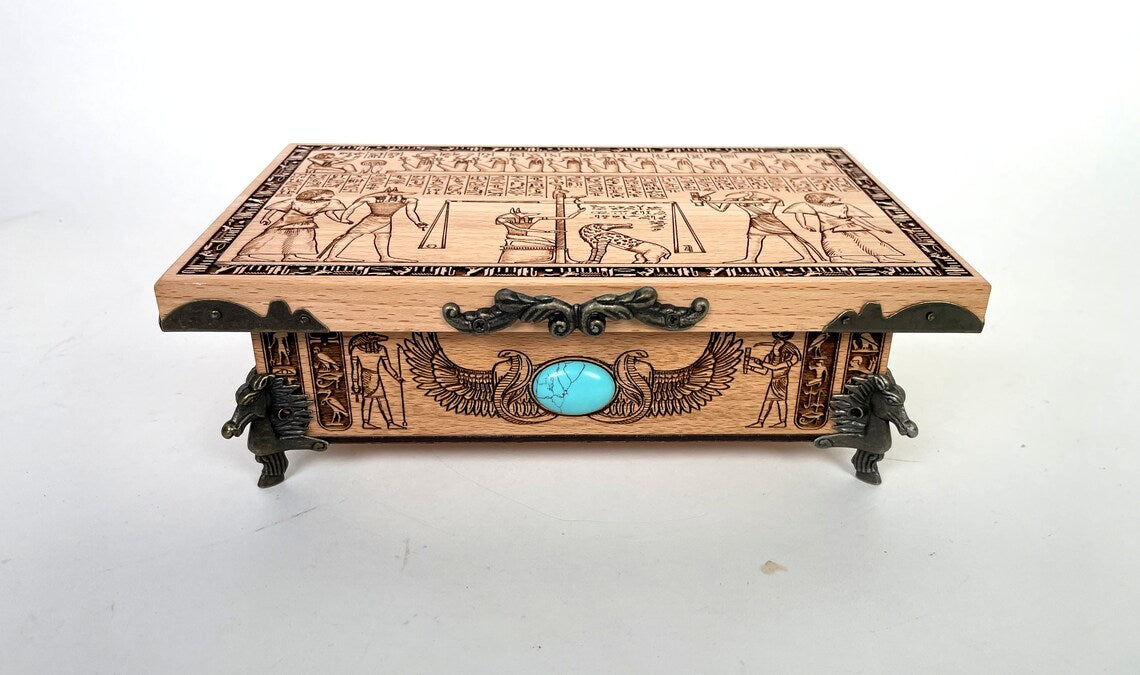 Ancient Egyptian Weighing of the Heart scene engraved on wooden tarot deck box lid
