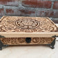 Close up of Hecate sigil engraving on wooden ritual storage chest

