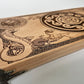 Close up of Hecate sigil engraved on wooden altar table for ritual practice
