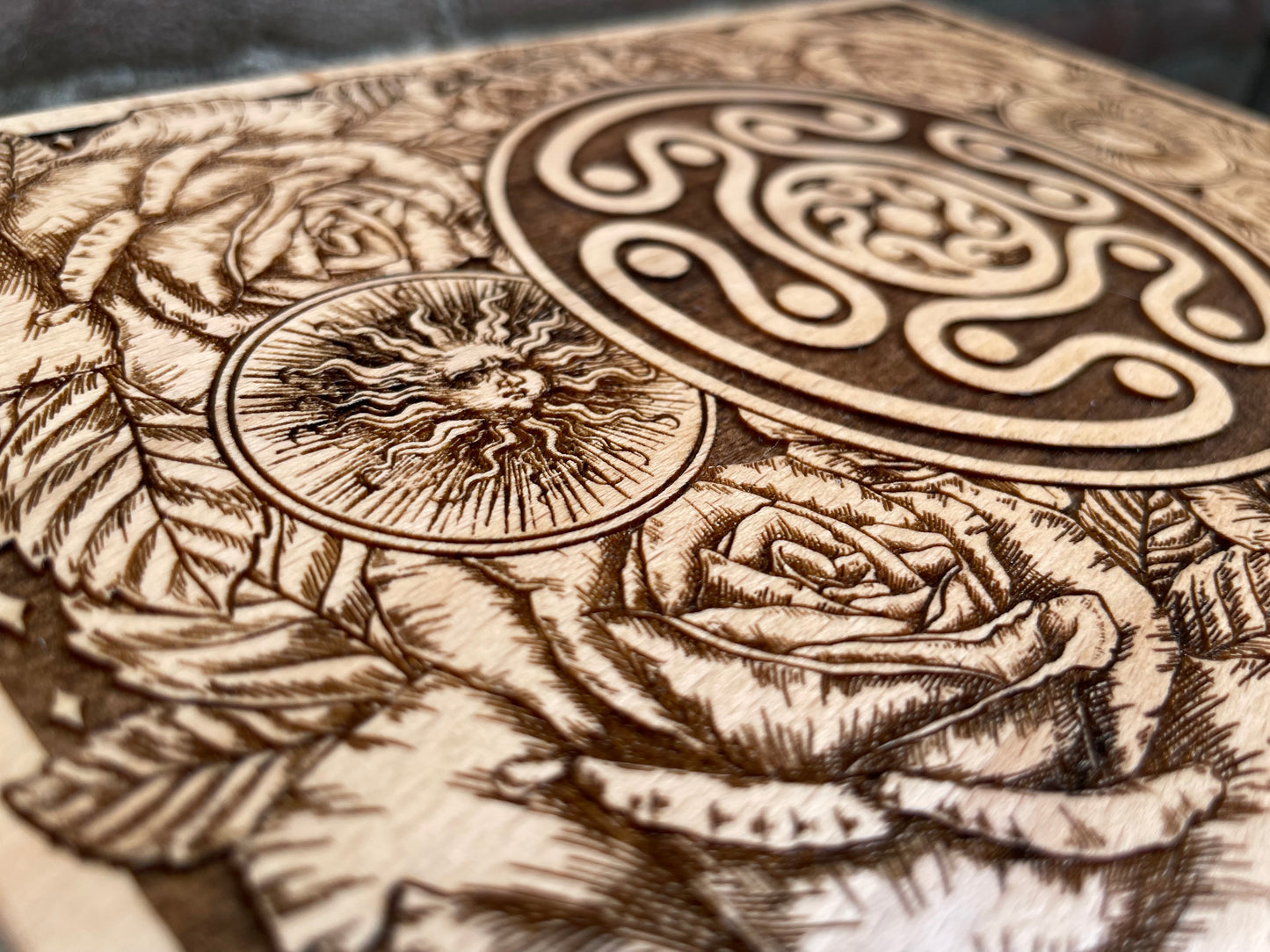 Close up of Hekate sigil engraving on wooden ritual storage chest

