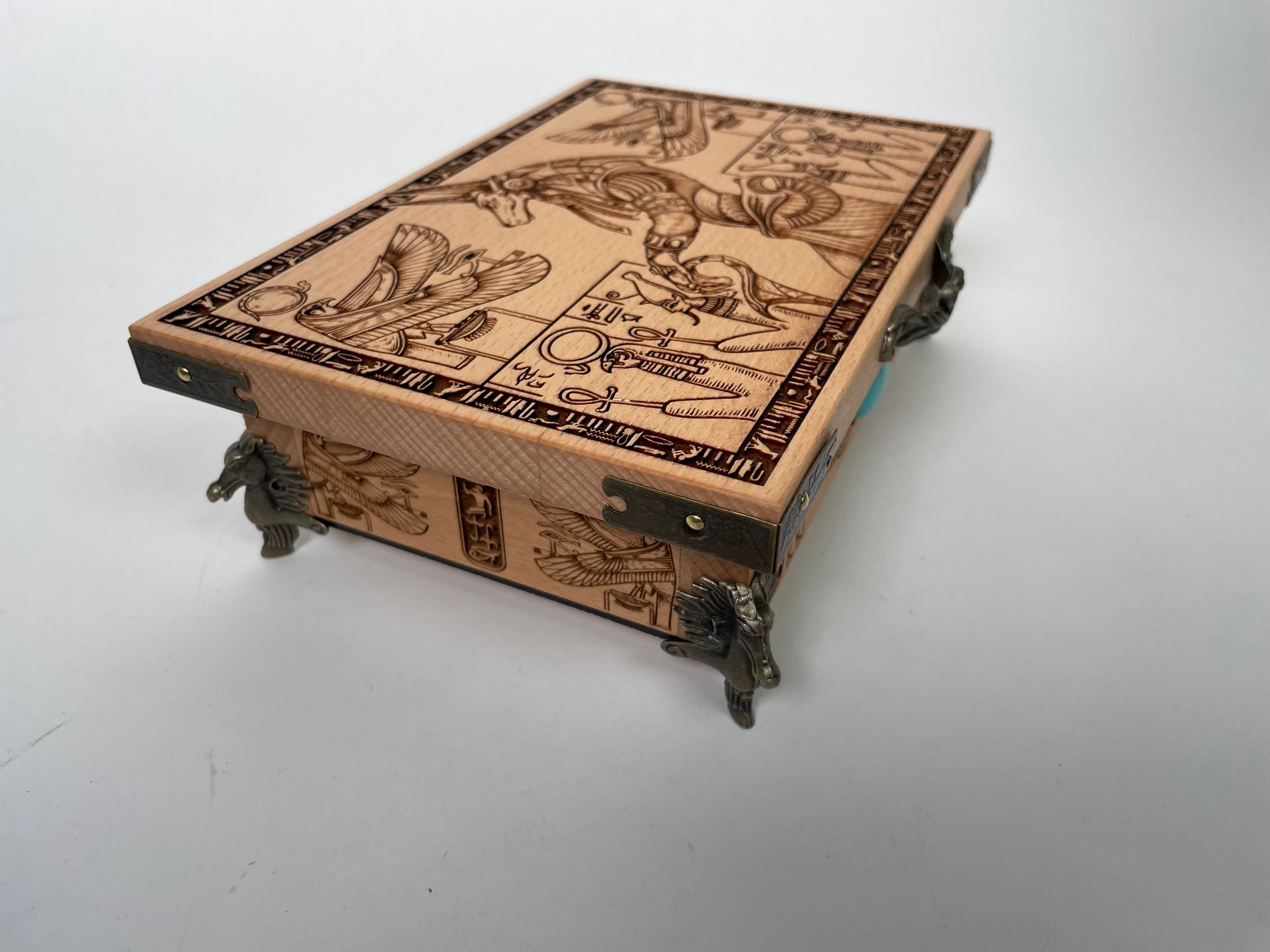 Intricate Egyptian tarot deck chest with Anubis guardian artwork engraved wood, spiritual altar decor
