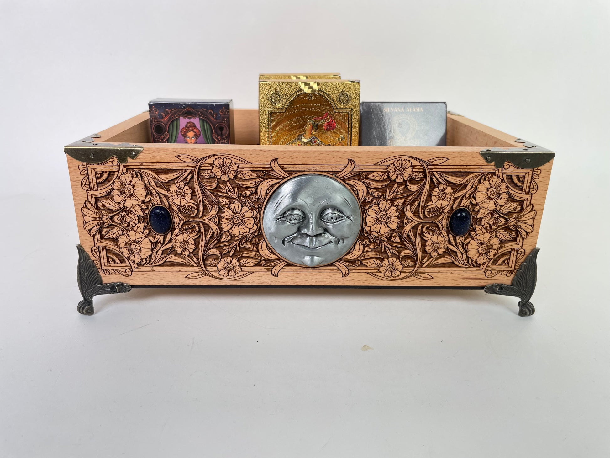 Close up of tarot deck storage compartments on wooden organizer box
