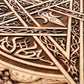 Close up of Celtic pentagram engraving on wooden ritual altar board
