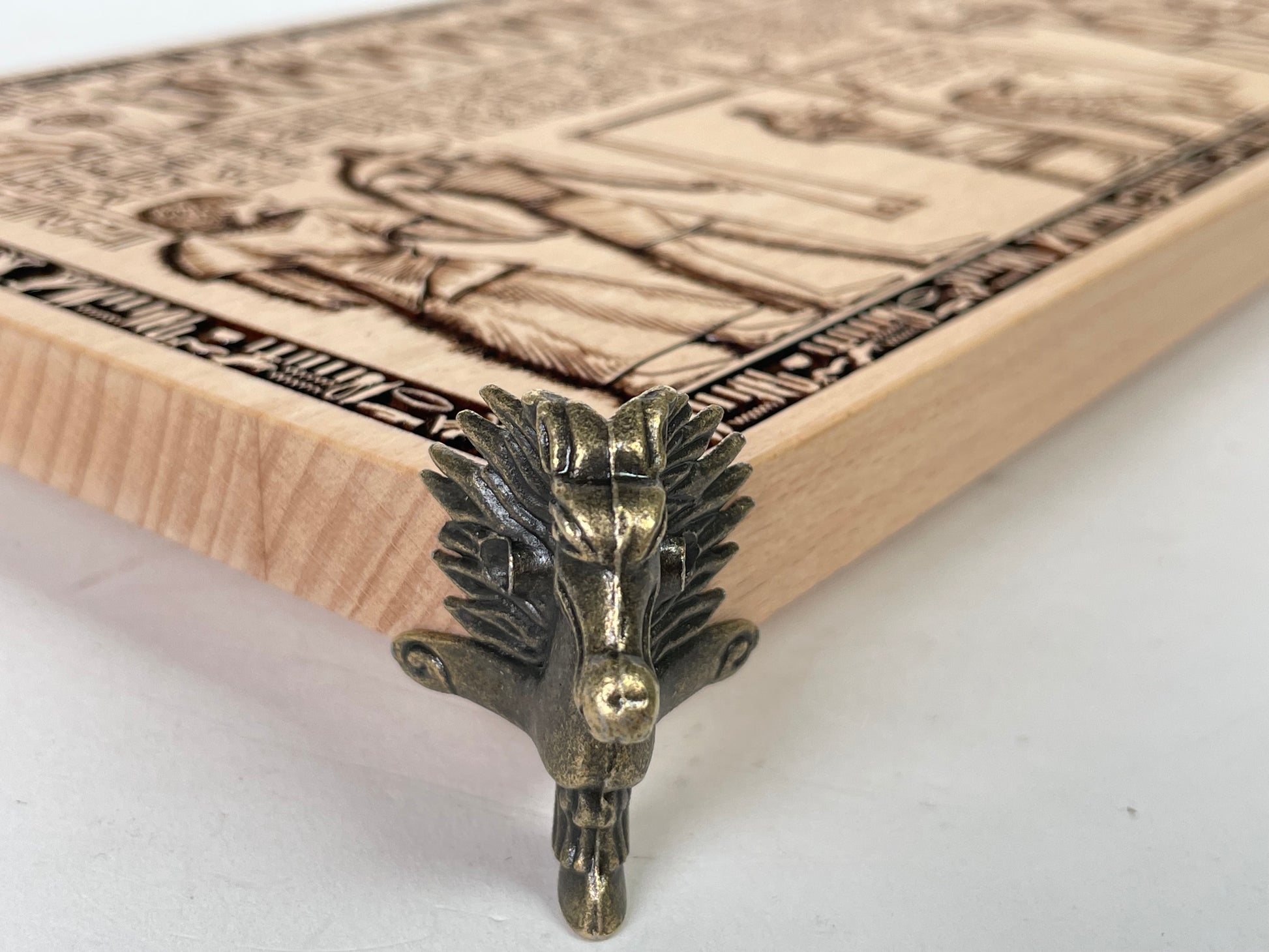 Close up of engraved Egyptian hieroglyphs and Weighing of the Heart on wooden altar board
