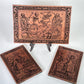 Solid engraved mahogany wood wall decor showing medieval memento mori imagery
