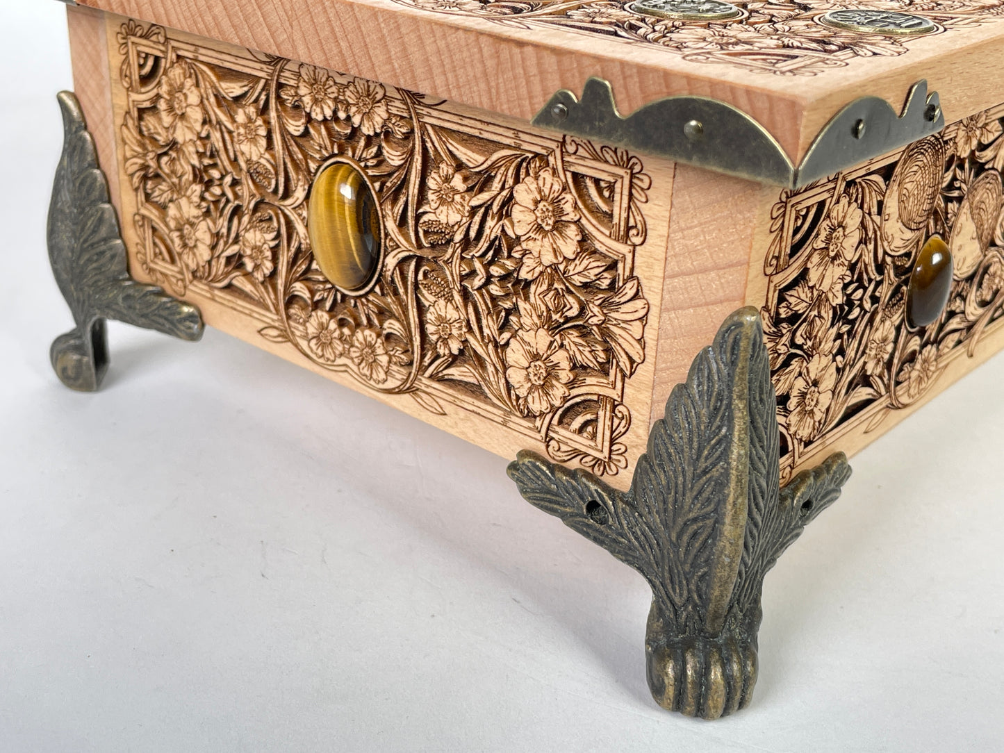 Close up of Wheel of the Year Ostara engraving on wooden altar table
