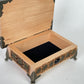 Small wooden altar box with built in storage holding tarot decks and crystals
