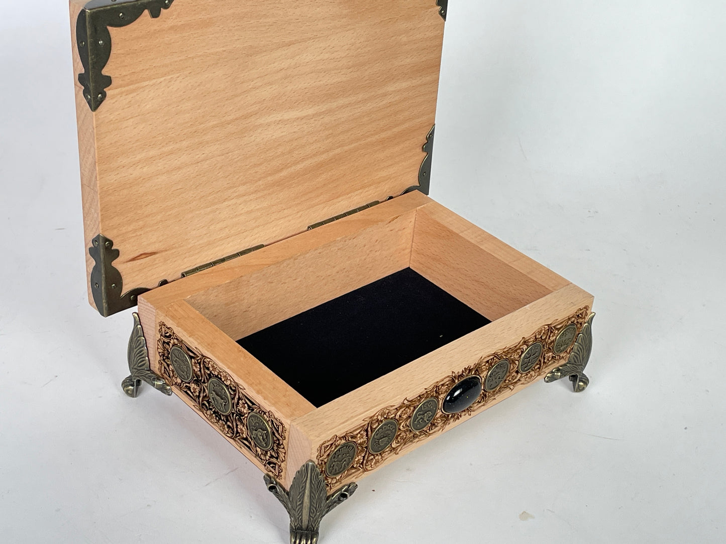Small wooden altar box with built in storage holding tarot decks and crystals
