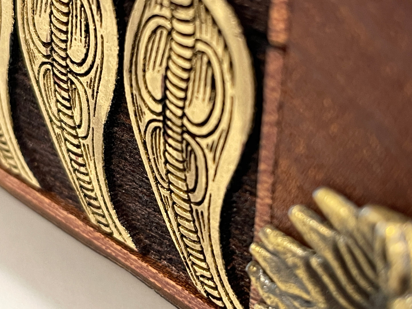 Detailed Side view of engraved mahogany Eye of Horus wooden storage chest
