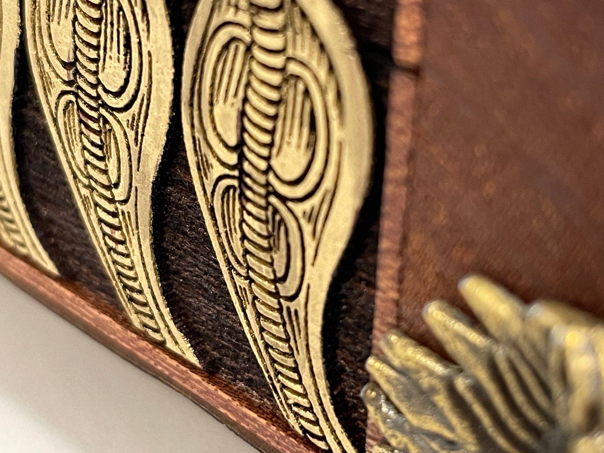 Detailed Side view of engraved mahogany Eye of Horus wooden storage chest

