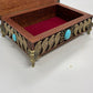 Open Hand-painted Egyptian Eye of Horus mahogany box displayed as altar decor
