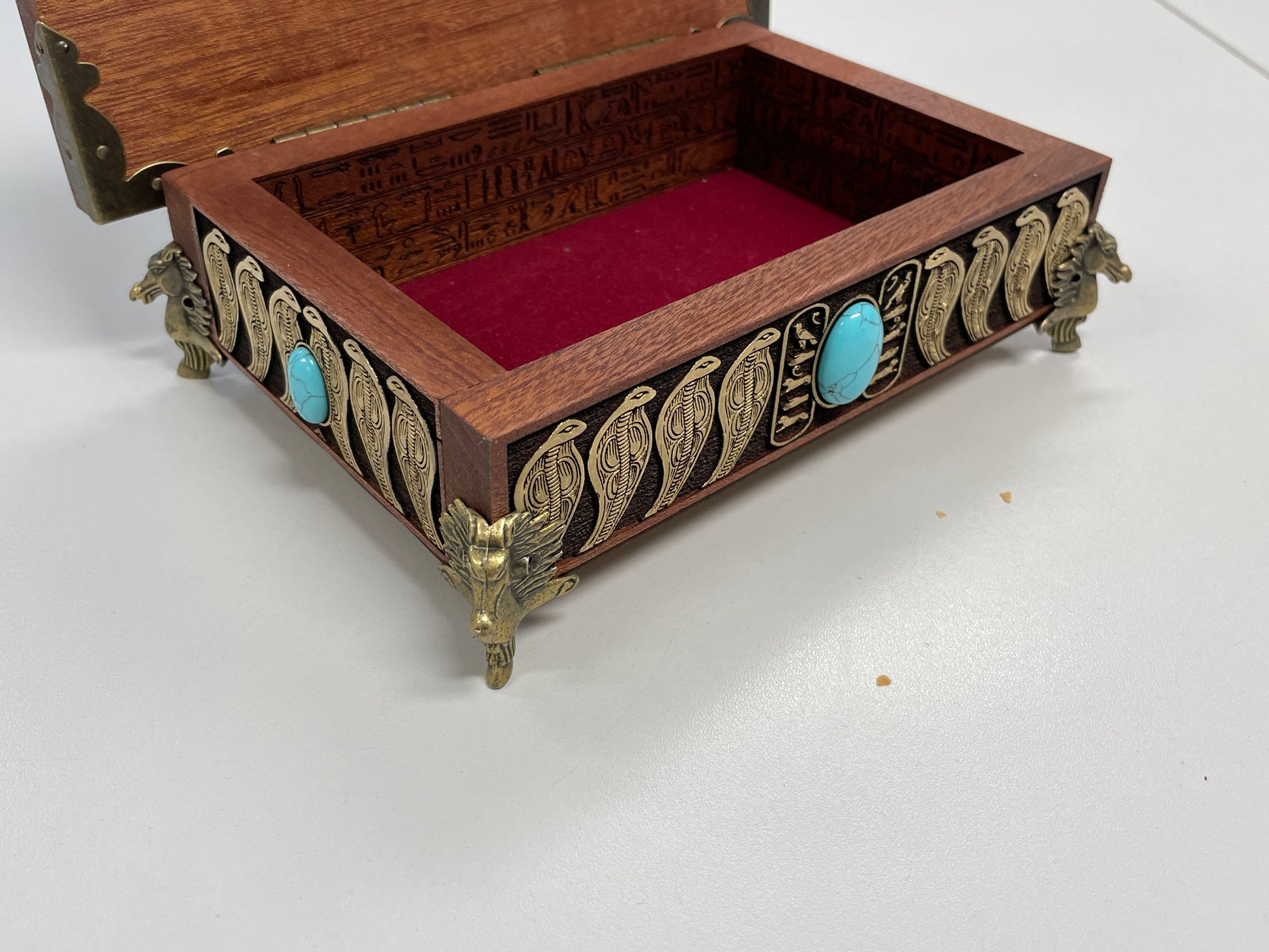 Open Hand-painted Egyptian Eye of Horus mahogany box displayed as altar decor
