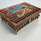 Side view of engraved mahogany Eye of Horus wooden storage chest
