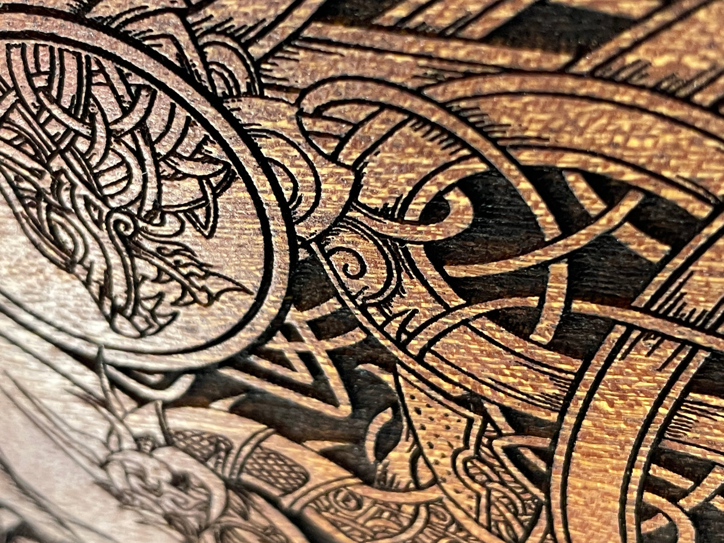 Side view of wooden Yggdrasil wall hanging with natural mahogany wood grain
