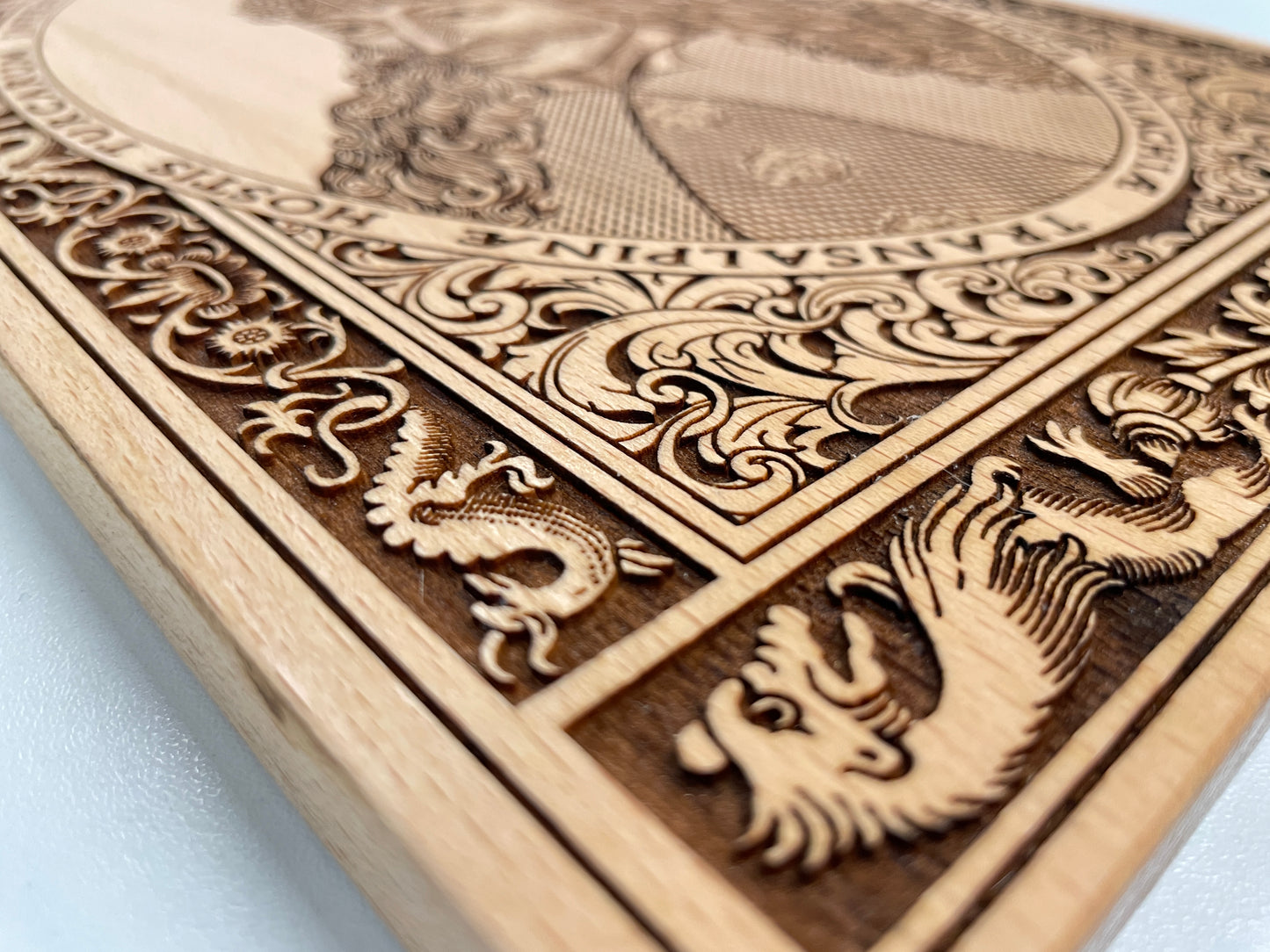 Close up of detailed deep engraving of Vlad the Impaler portrait on beech wood wall art