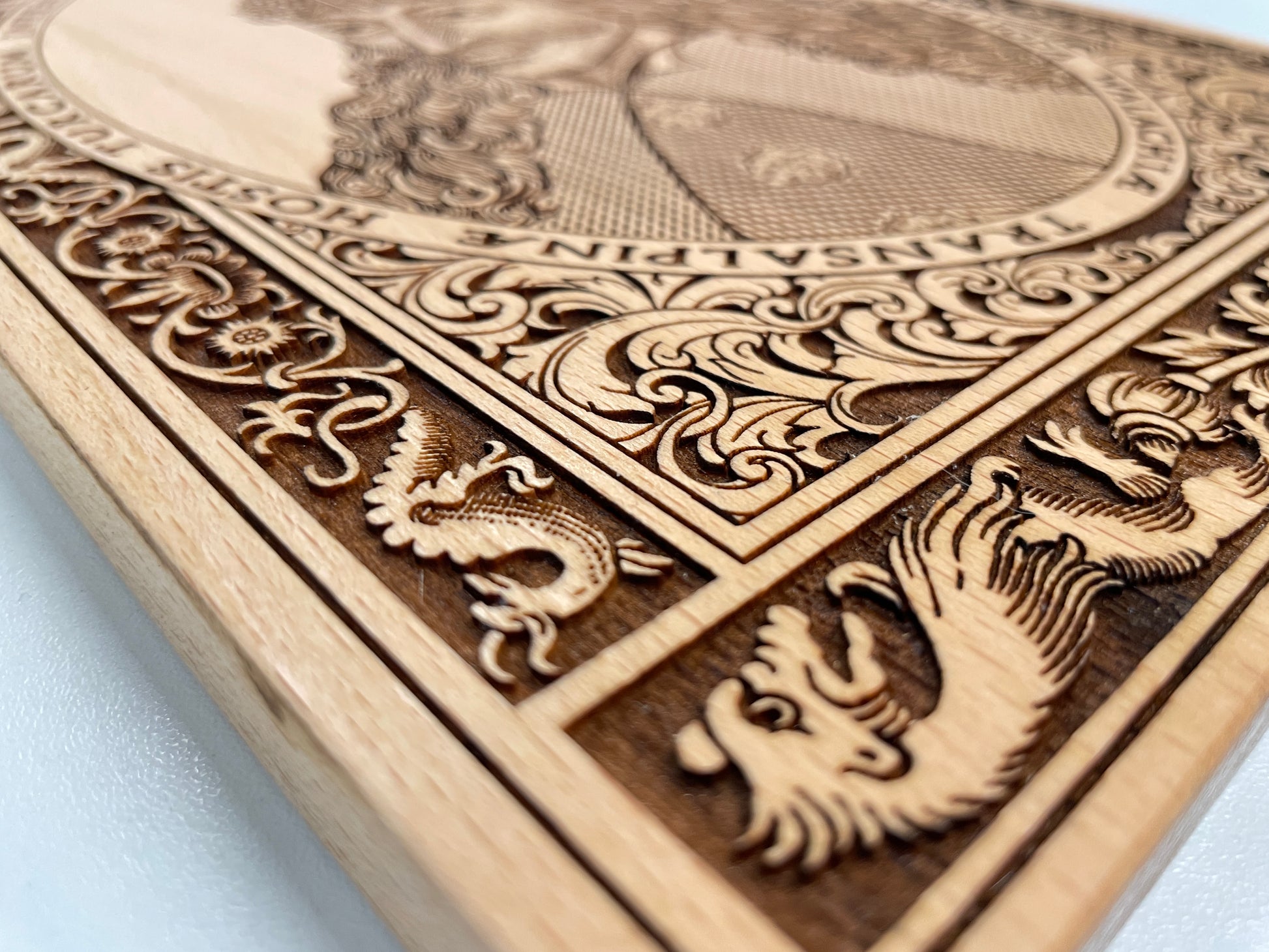 Close up of detailed deep engraving of Vlad the Impaler portrait on beech wood wall art