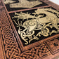 Wooden panel with intricate Viking carvings and a dragon design on a white background