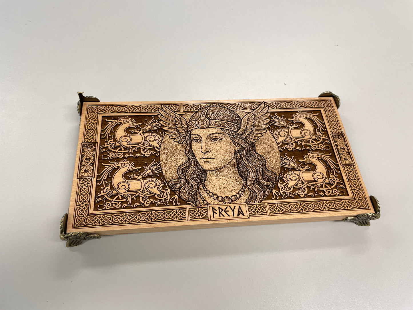 Wooden Freya altar board used with candles crystals and ritual tools
