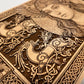Close up of Freya Norse goddess engraving on wooden altar decor

