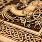 Close-up of intricate Celtic knot design on a wooden surface