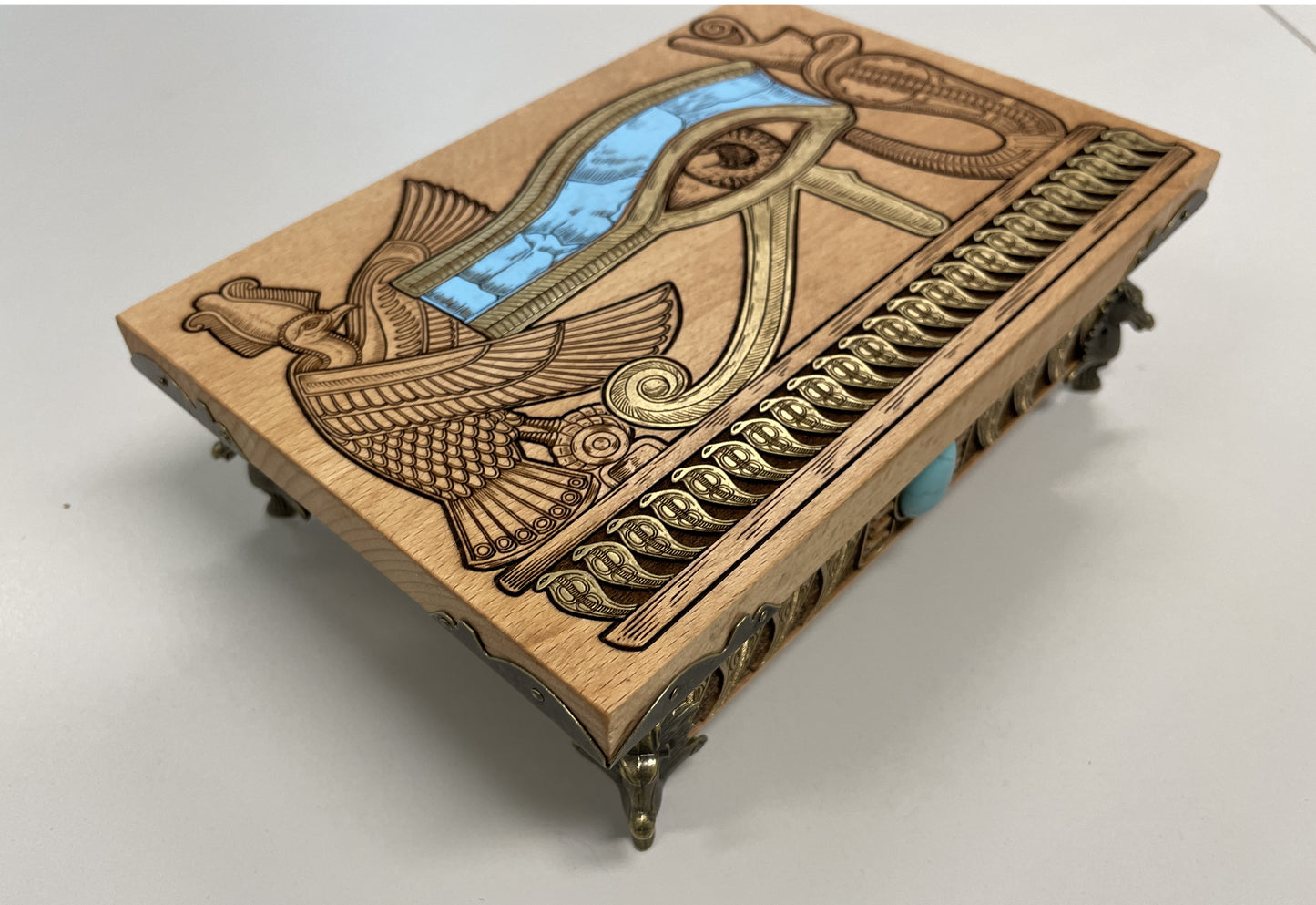 Side view of Egyptian altar box showing engraved cobras and turquoise stone, Eye of Horus tarot card storage chest