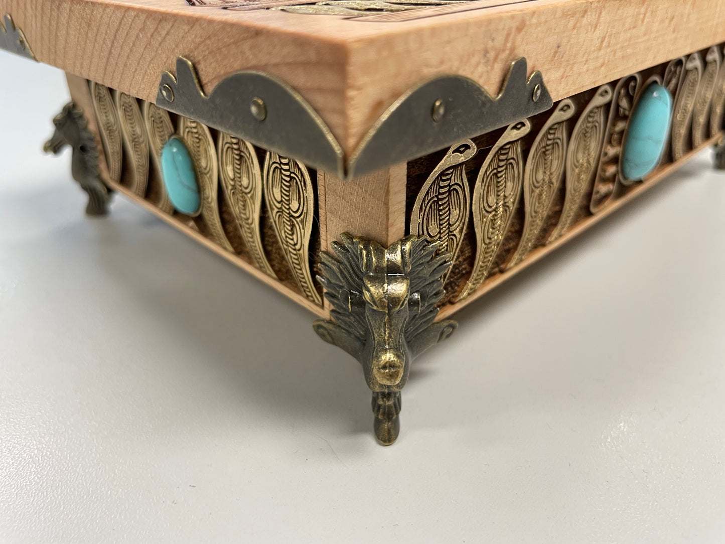 Detailed wood engraving of Eye of Horus altar box, Egyptian symbolism with winged deity and protective serpent border