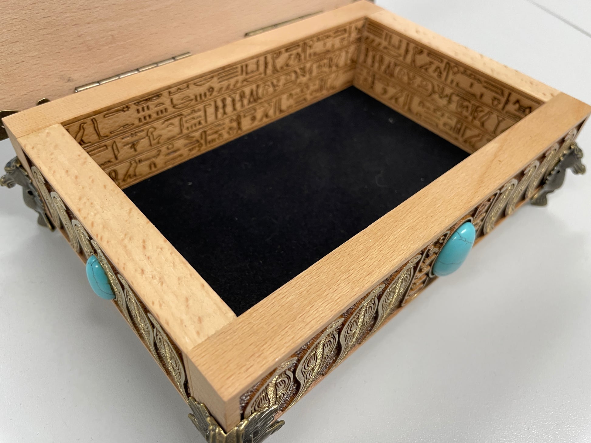 Interior view of Egyptian Eye of Horus altar box with engraved hieroglyphs, wooden tarot and oracle card storage chest