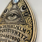 detailed view of  Ouija board wall art wooden spirit board planchette with all seeing eye gothic occult wall decoration