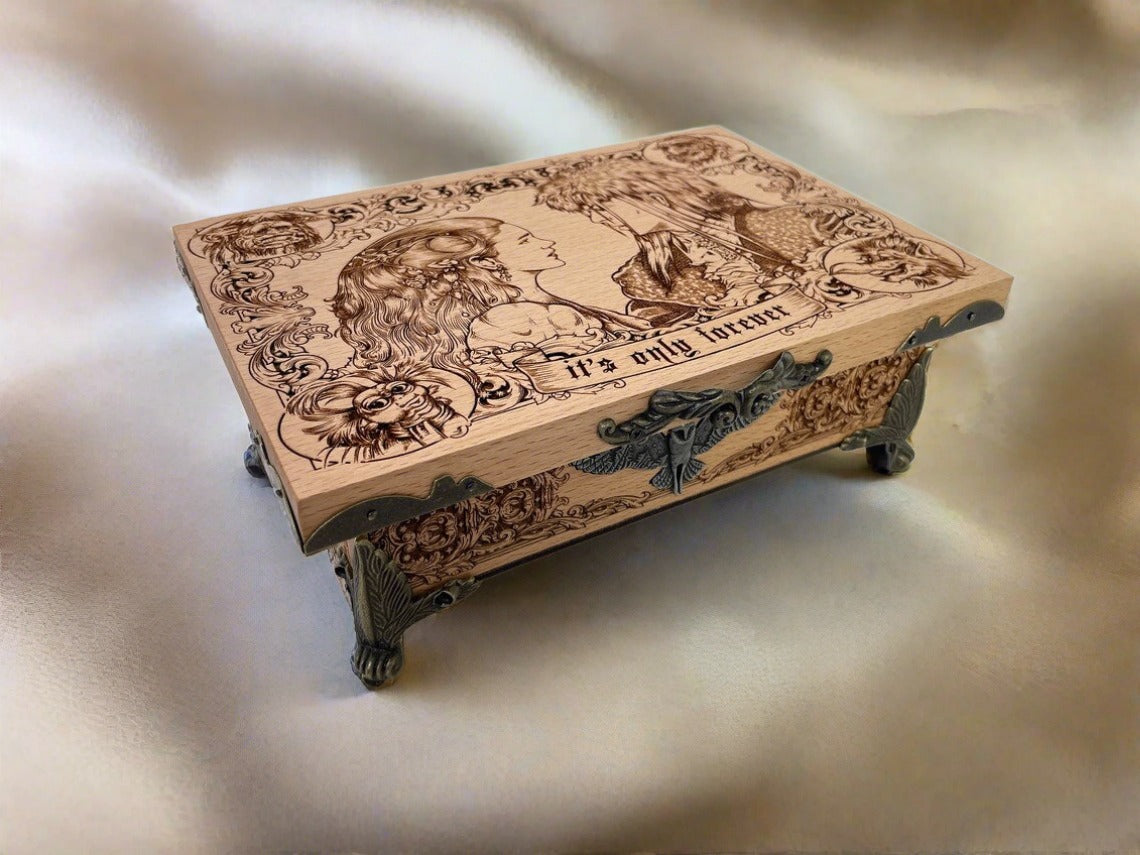 Close up of engraved Labyrinth artwork on wooden fantasy music box
