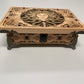 Decorative Medusa wooden box with intricate carvings on a white background