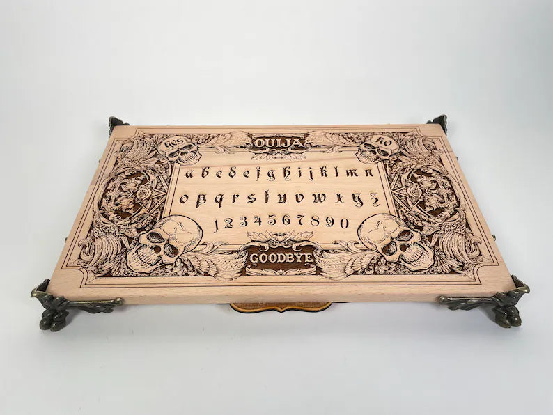 ouija board engraved on solid wood with skulls and demons