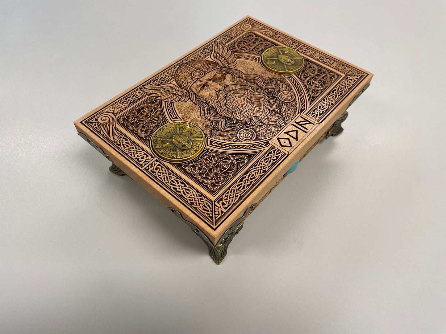 Side view of engraved Norse wooden keepsake box showing wood grain
