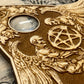Close up detail of engraved gothic planchette with glass eye