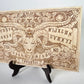 Engraved celestial Ouija board with engraved floral and solar artwork for meditation and energy practice
