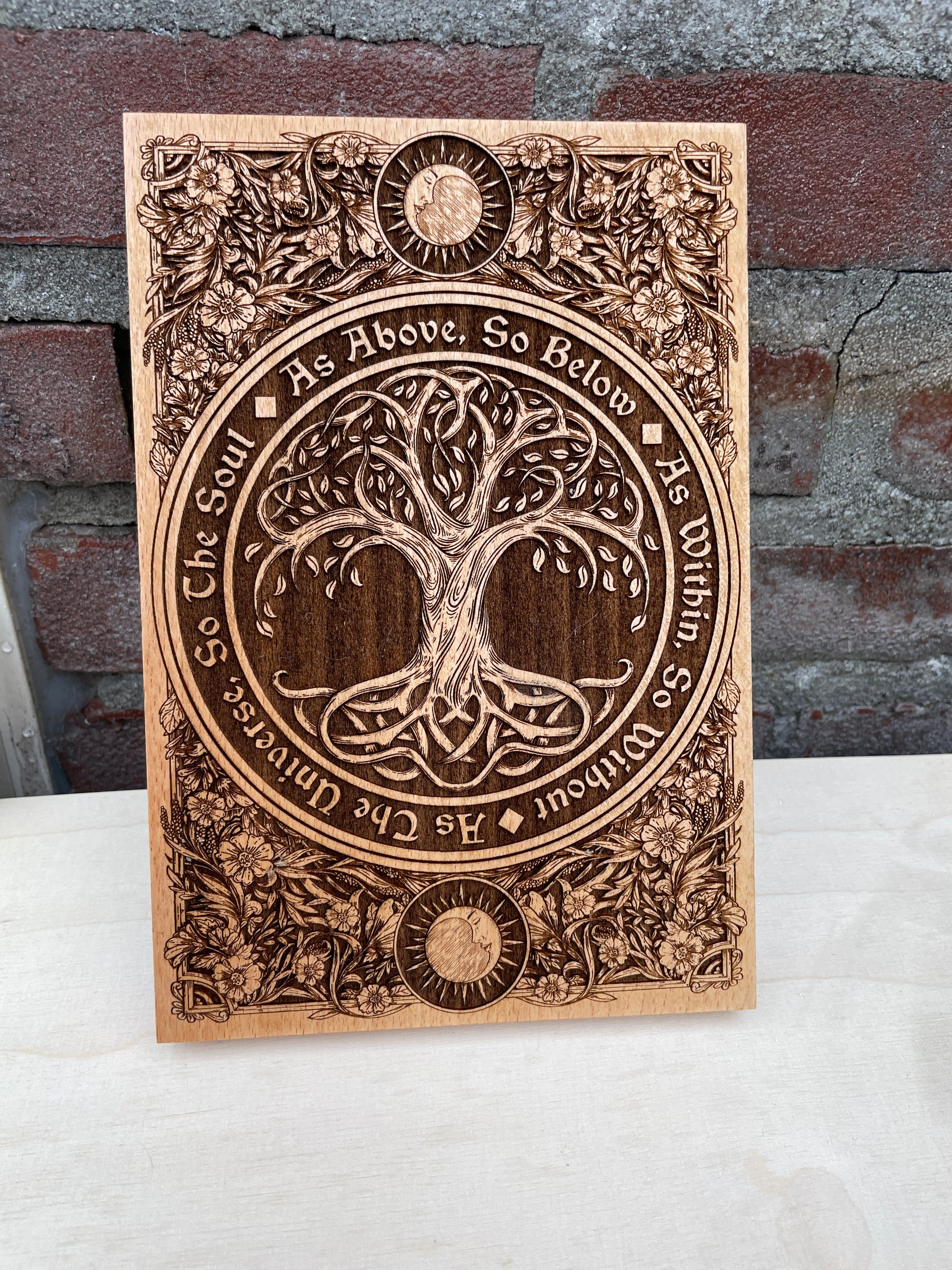 Sacred geometry and Wiccan spiritual wall art engraved on hand-painted wood for meditation space