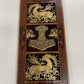 Decorative panel with Celtic designs and a central Thor hammer symbol on a white background