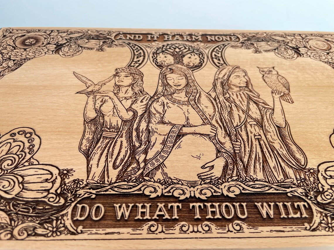 Close up of Triple Moon Goddess engraving on luxury Wiccan altar box
