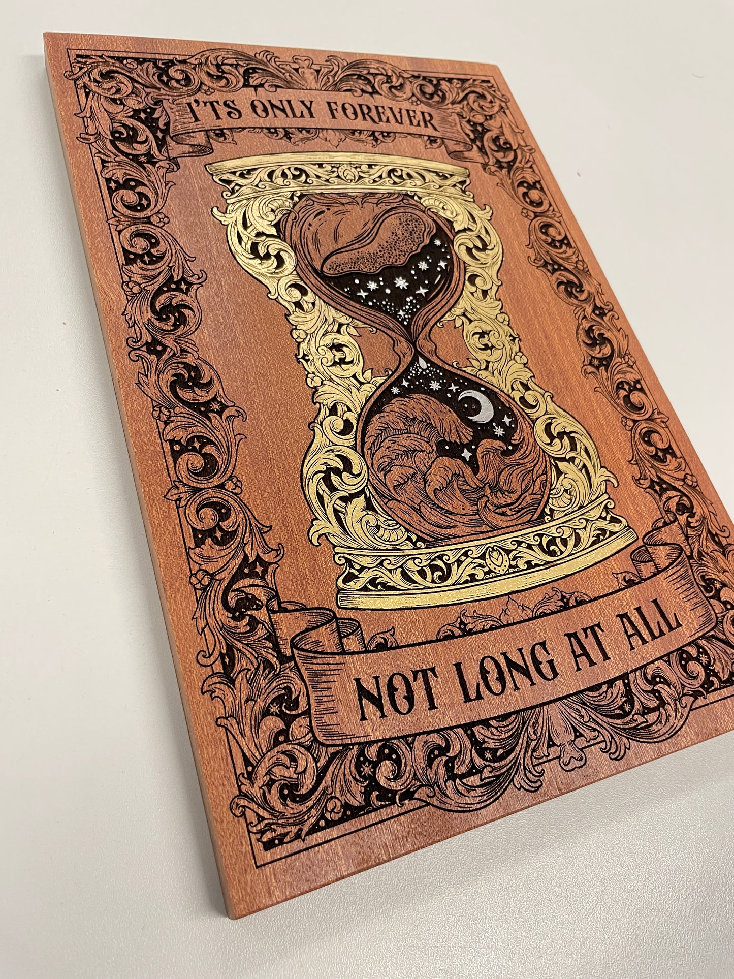 Close up of engraved Labyrinth quote wall decor with hand-painted gold accents
